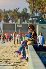 a girl roller skates along the embankment