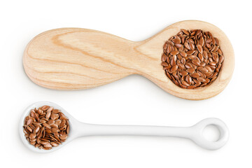 flaxseed in wooden and ceramic spoon isolated on white background. Top view. Flat lay