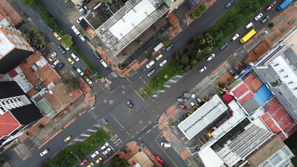 Aerial view of an urban intersection with streets and traffic flows in the high altitude Andean city Bogota, Colombia, South America.