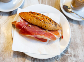 Appetizing delicious ham sandwich and a cup of hot coffee. Healthy breakfast