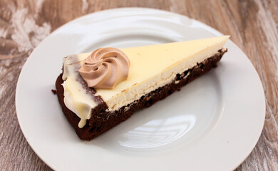 Traditional German pie from chocolate crust with fluffy caramel whipped cream