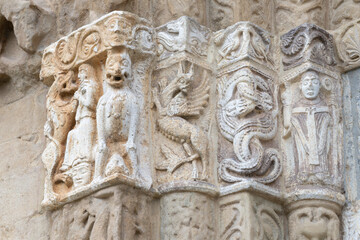 Pavia - The detail of Romanesque portal of church Basilica di San Michaele Maggiore