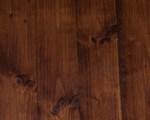 Richly textured wooden surface showcasing natural patterns and warm brown tones
