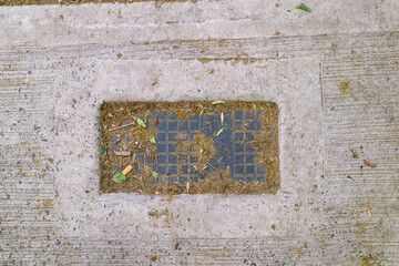 There is a solid concrete surface that features a squareshaped hole located right in the center of...