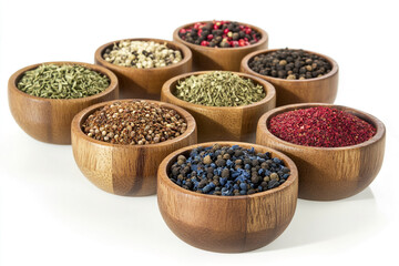 Eight wooden bowls filled with different spices are lined up on a white surface