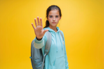Young girl advocating for education equality and anti-bullying efforts, showing resilience and determination. Yellow background. Awareness poster.