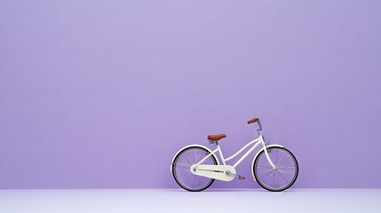Fototapeta premium A white bicycle is parked against a purple wall, featuring a wooden seat at the front and handlebars positioned behind the bike