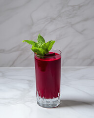 Beetroot Juice with Mint Garnish on Minimalist Background