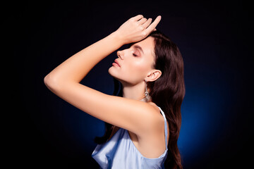 Photo of girl stand profile side touch hand head close eyes isolated dark color background