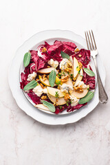  Salad with Gorgonzola or blue cheese with pears, honey and nuts, leaves of Italian red lettuce Radicchio (Radicchio rosso di Treviso, Veneto) , winter salad recipes, sweet and salty taste