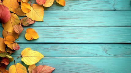 Autumn leaves on rustic blue wooden backdrop
