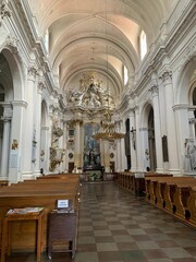 Fototapeta premium Explore the stunning architectural beauty of a historic Baroque church. This image captures the grandeur of ornate ceilings, elegant pews, and intricate decorations, evoking a sense of reverence and