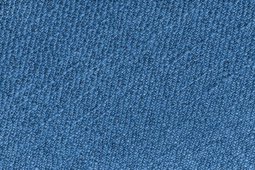 Blue Jacquard fabric with diagonal woven, coarse weave texture upholstery cloth. Textile background, furniture textile material, wallpaper, backdrop. Cloth structure close up, macro.