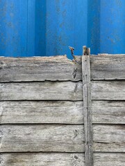 Dilapidated old wooden fence showing weathered wood grain detail