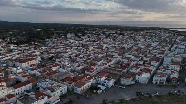ripresa aerea della cittadina di Calasetta durante il tramonto