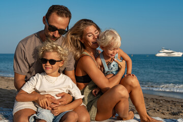 Family Enjoying Playful Moments on the Beach by the Sea