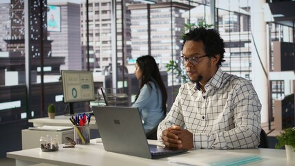 African american CEO joins an online meeting to discuss corporate objectives and administrative...