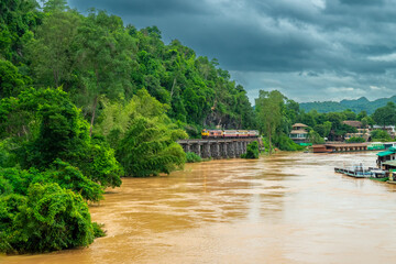 Naklejka premium Trains running on death railways track crossing kwai river in kanchanaburi thailand this railways important destination of world war II history builted by soldier prisoners.