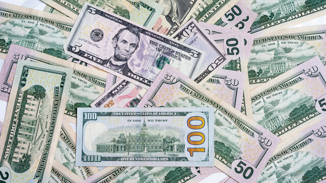 Assorted US Dollar Bills Representing Wealth and Finance