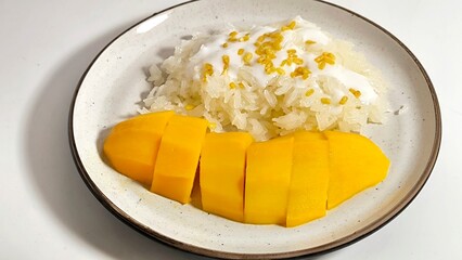 Mango sticky rice. Thai dessert made with glutinous rice, fresh mango and coconut milk. khao niew ma muang