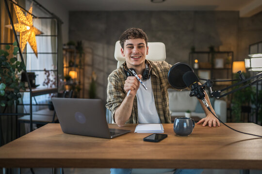 Young man technology blogger record video blog or v-log of new gadget