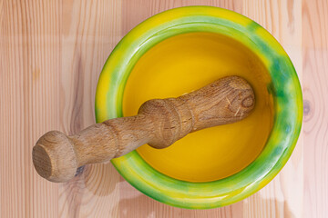 An earthenware mortar with a wooden stick is widely used in Catalonia to crush and pound garlic