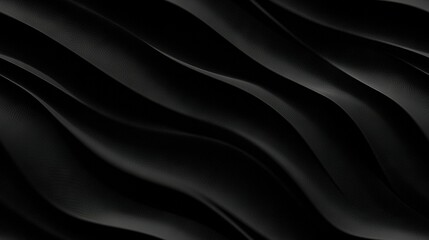 Fototapeta premium A monochrome image of undulating lines on dark fabric resembling paper