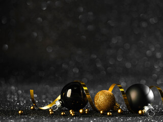 Gold and black christmas balls in the dark