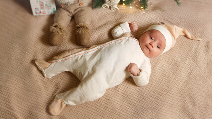 Newborn baby lies on Christmas and New Year Eve.