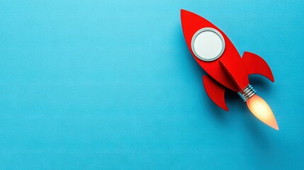   Red toy rocket ship sits on blue surface with magnifying glass above