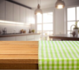 Empty wooden table in bright kitchen interior