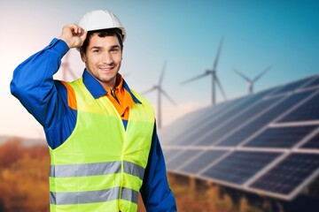 A power engineer installs roof solar panels