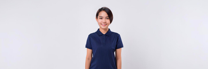 A portrait of a young East Asian woman wearing a navy blue polo shirt and smiling against a white background.