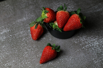 Fresh Strawberries on dark background. Summer red fruit with Copy space for text. Organic healthy eating.