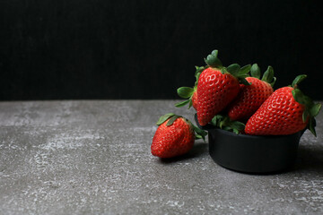 Fresh Strawberries on dark background. Summer red fruit with Copy space for text. Organic healthy eating.