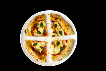 Anchovy pizza isolated on black background top view