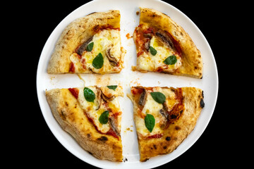 Anchovy pizza isolated on black background top view