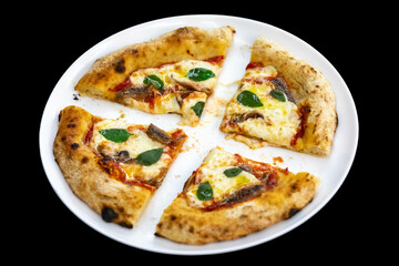 Anchovy pizza isolated on black background top view