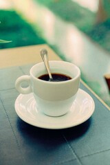 a cup of coffee on the table