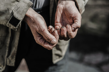 mechanic with dirty hands after fixing the brakes