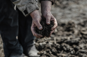 Farmer dirty hands on bio farm in nature, farming concept panorama banner.