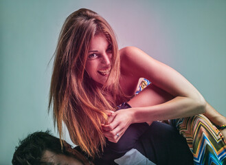 Joyful piggyback moment with laughter and flowing hair