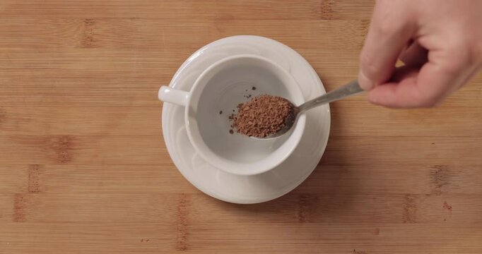 Making morning coffee, measuring portion, instant product