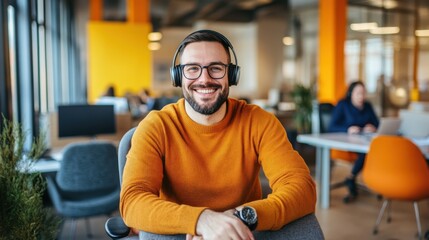 Obraz premium Smiling male call-center operator with headphones,