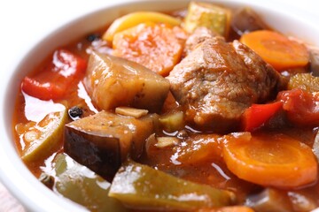 Delicious stew with vegetables in bowl, closeup