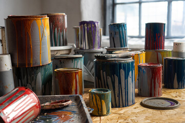 Paint Cans. Used cans of colored paint. Oil-based enamel, lacquer, shellac and varnish leftovers....