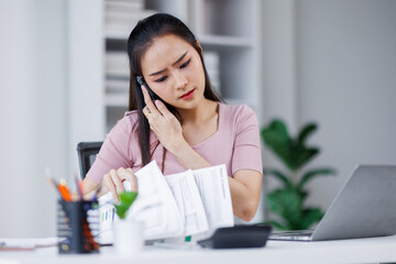 Cheerful business Asian woman freelancer making telephone call share good news about project...