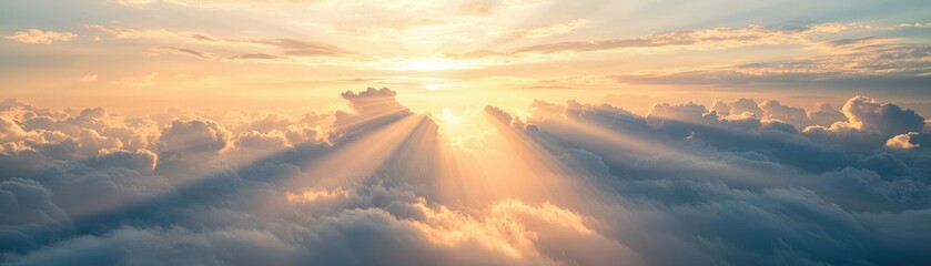 Fototapeta premium A serene, picturesque sky view featuring soft clouds illuminated by golden sunlight, creating a tranquil and uplifting atmosphere.