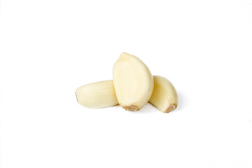 Peeled garlic cloves isolated on white background. Food ingredients