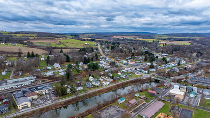 Fototapeta premium Aerial image over Marathon, NY on a cloudy, overcast fall afternoon, November 11, 2024. 